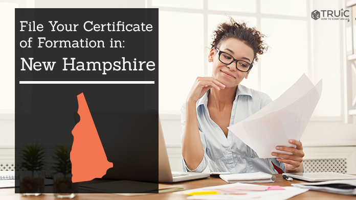 Woman smiling while looking at her certificate of formation for New Hampshire.