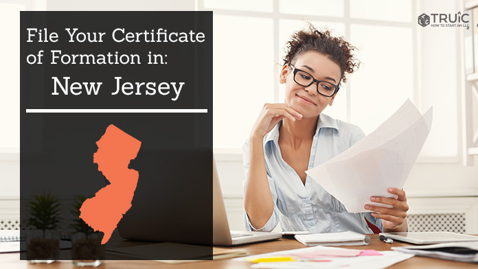 Woman smiling while looking at her certificate of formation for New Jersey.