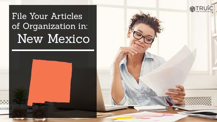 Woman smiling while looking at her articles of organization for New Mexico.