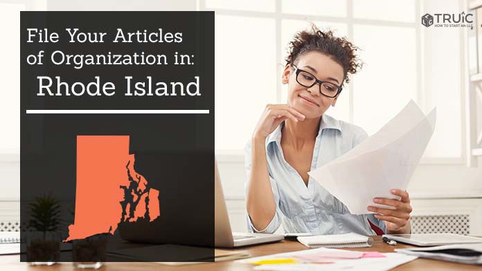 Woman smiling while looking at her articles of organization for Rhode Island.