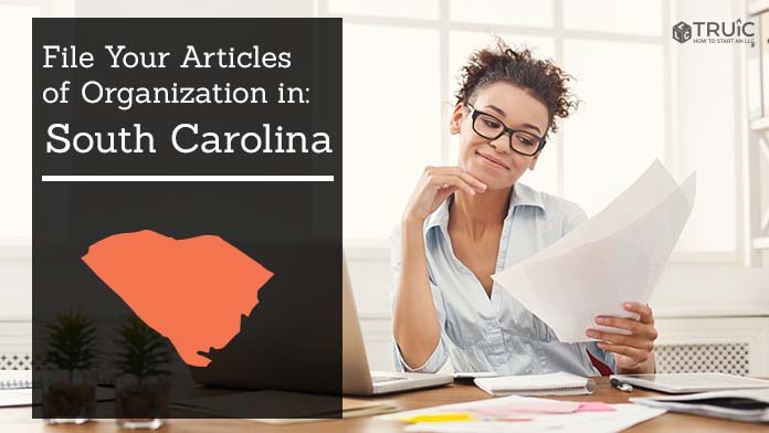 Woman smiling while looking at her articles of organization for South Carolina.