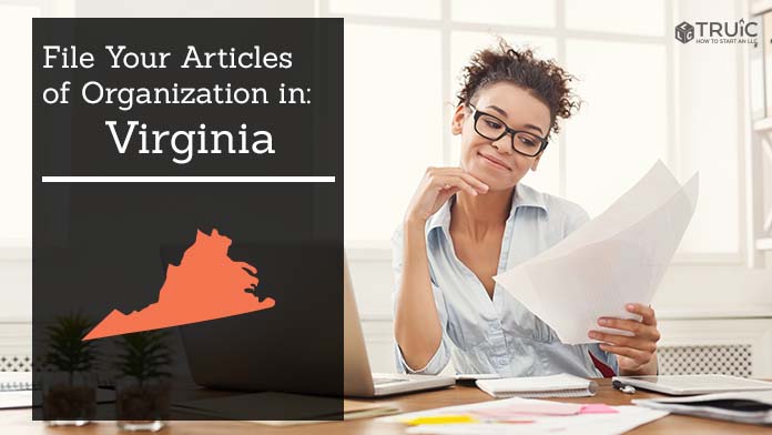 Woman smiling while looking at her articles of organization for Virginia.