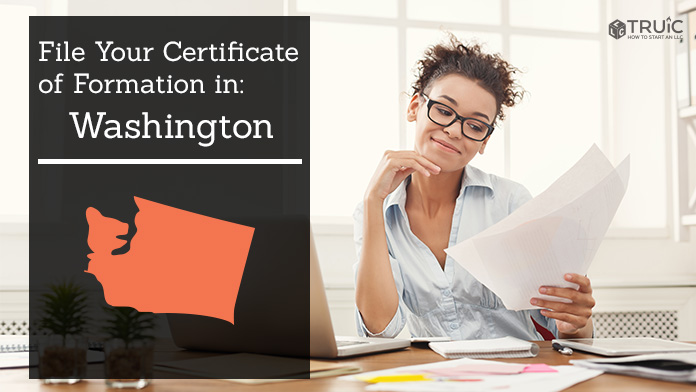 Woman smiling while looking at her Certificate of Formation for Washington.