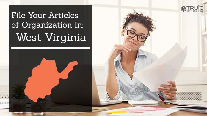 Woman smiling while looking at her articles of organization for West Virginia.