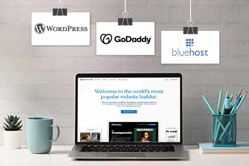 Laptop monitor featuring WordPress, GoDaddy, and BlueHost