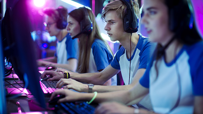 Row of male and female gamers