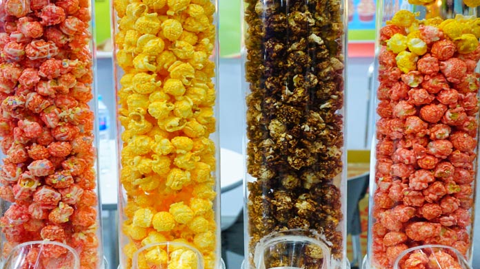 Dispensers full of different types of popcorn