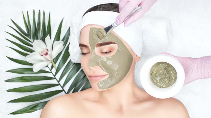 A Woman getting face mask. 