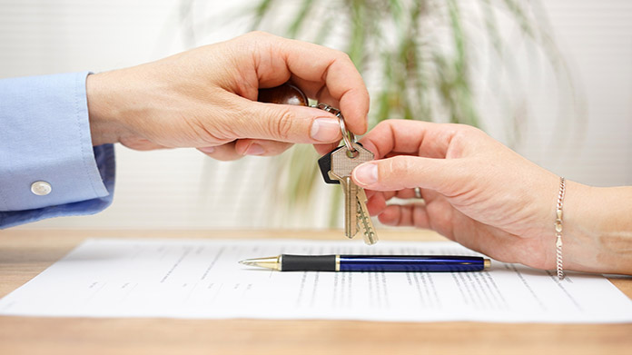 Hands passing over property keys