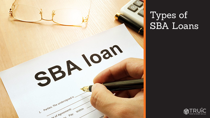Person filling out document titled "SBA loan"