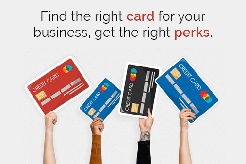 Four arms holding four different credit cards in the air