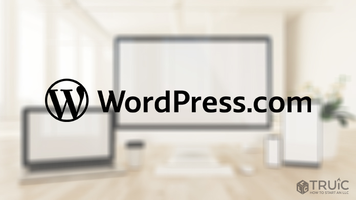 WordPress.com logo over blurred background.