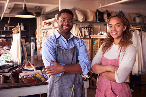 Businessman and businesswoman posing.